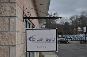 Murfreesboro Wayfinding Signs outdoor hanging blade sign blue sea building business wayfinding address sign 300x199